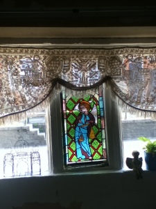 Vintage lace and St Michael window