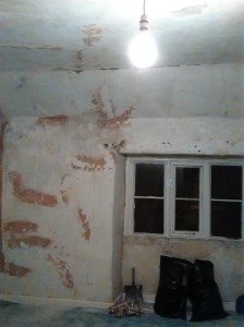 The studio, with damp. peeling wallpaper removed